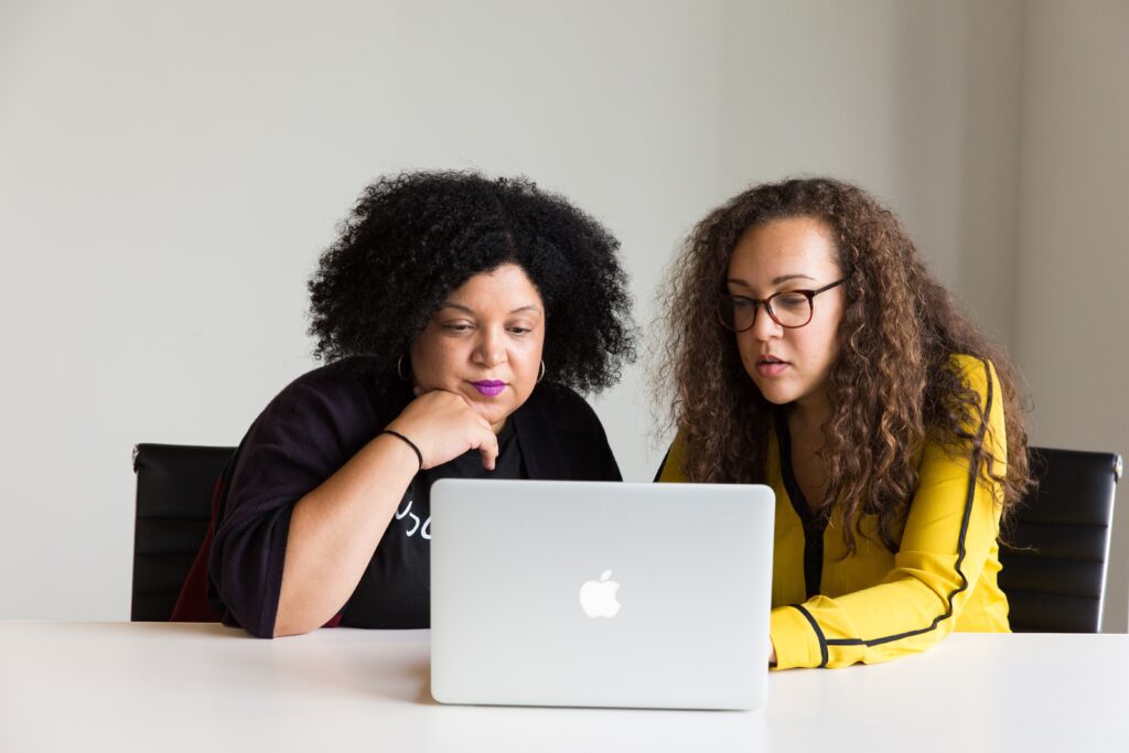 event planning internship - photo of two women sitting at a laptop