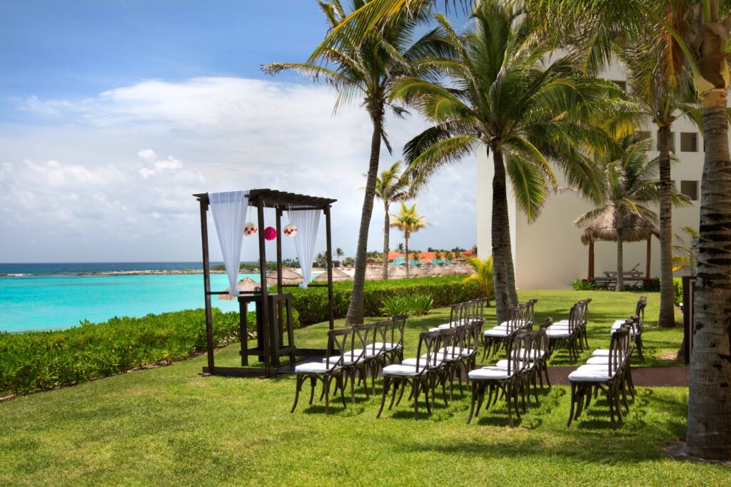 Planning a destination wedding in Mexico? Check out this image of an altar and ceremony chairs lined up on the beachfront in Cancun, Mexico.
