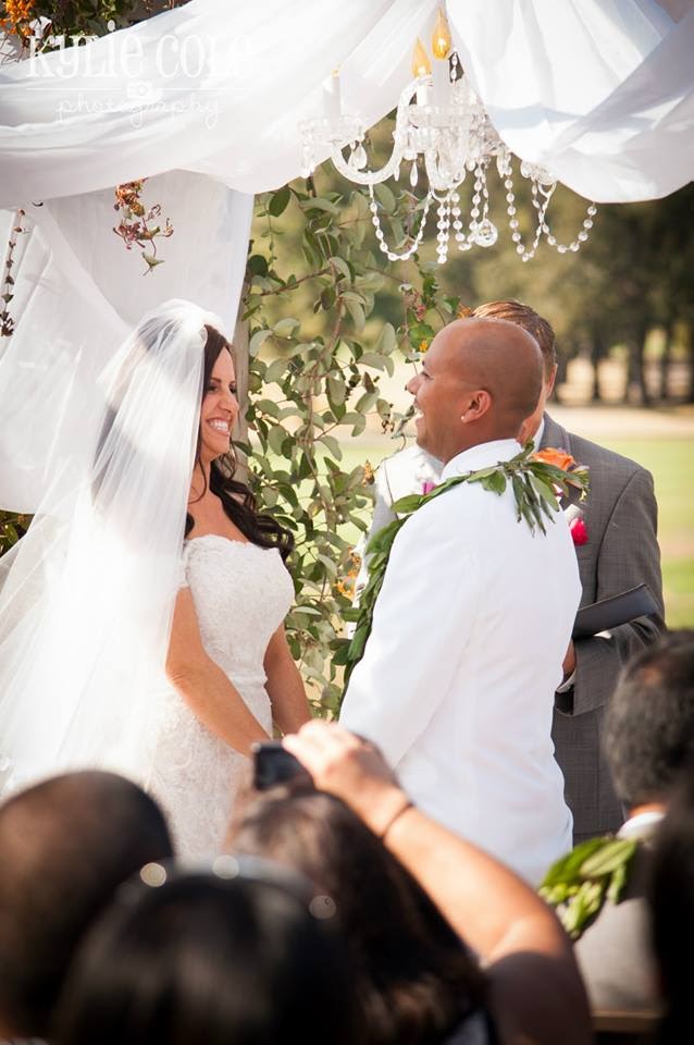 Image of a bride and groom at the wedding canopy