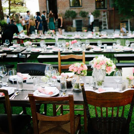 Wedding venues in The Dalles, Oregon. Photo of decorated tables in an open courtyard near a brick building.