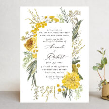 a wedding invitation with a floral motif