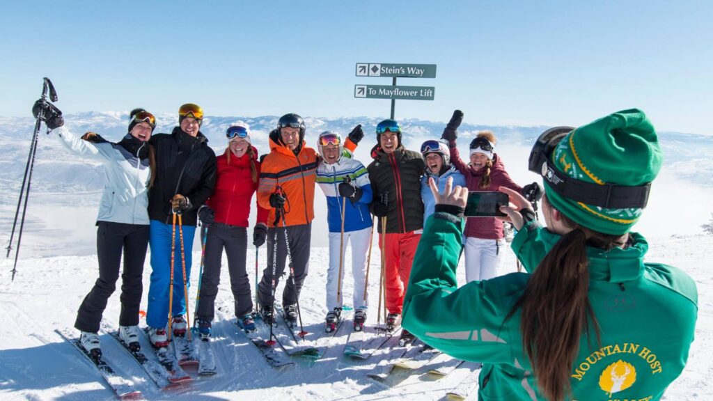 A group of skiers smiling at Deer Valley Resort - Group Travel